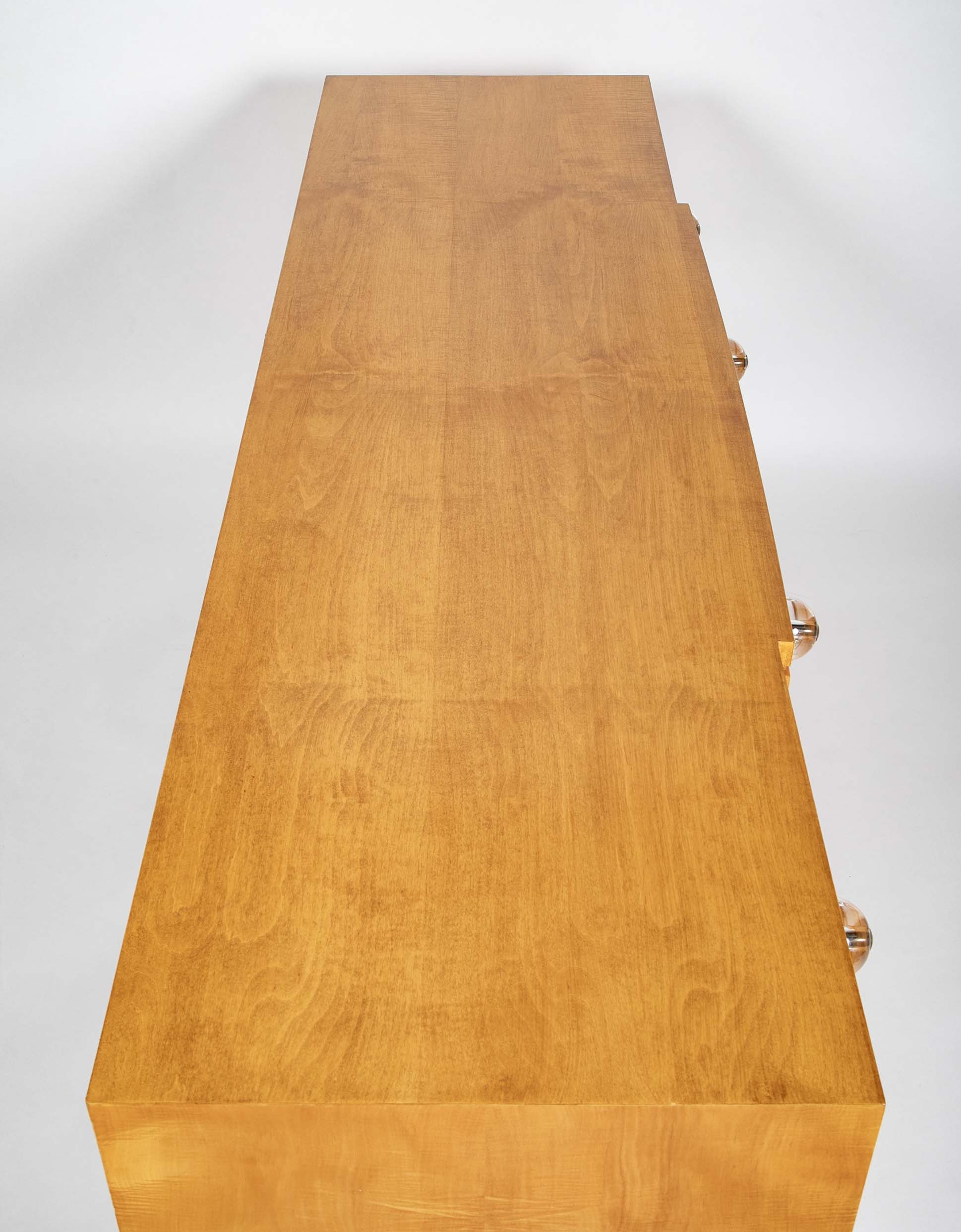 A French Sycamore Veneered Chest of Drawers Attributed to Andre Arbus