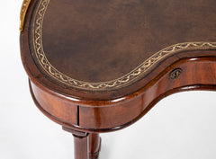 An English Regency Kidney Shaped Mahogany Desk