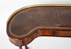 An English Regency Kidney Shaped Mahogany Desk