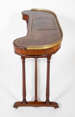 An English Regency Kidney Shaped Mahogany Desk