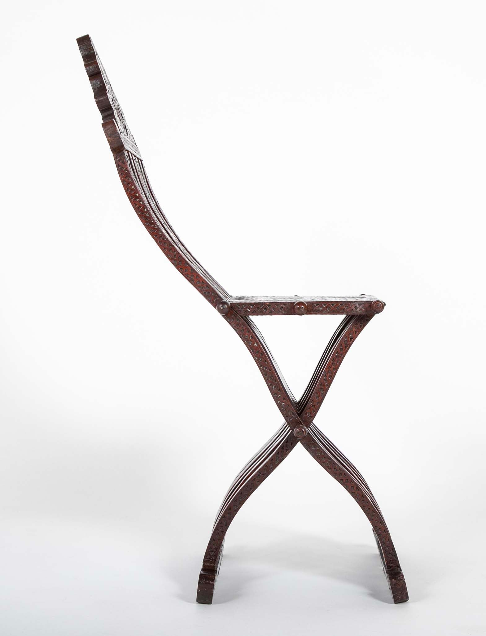 A Syrian Carved Hardwood Folding Chair with Abalone Inlays