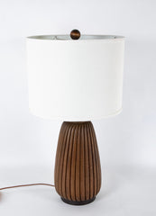 An Elongated Melon Shaped Wooden Lamp