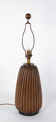 An Elongated Melon Shaped Wooden Lamp