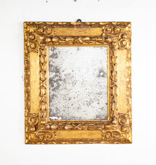 A Deeply Carved Continental Giltwood Mirror