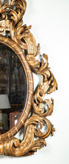 Large Oval Italian Mirror with Baroque Carved Giltwood Frame