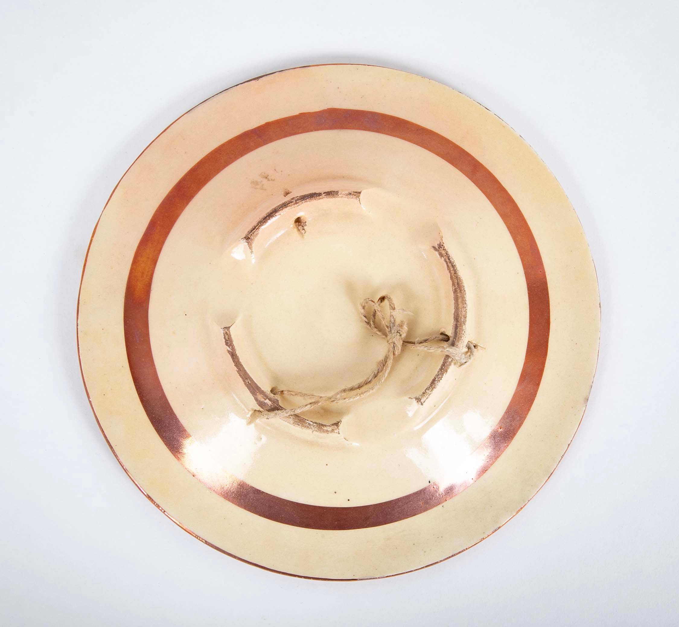 Two Round Copper Lustre Plates with Stylized X Design