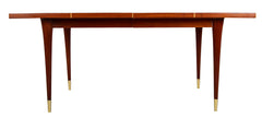 A Tommi Parzinger For Charak Modern Mahogany and Maple Dining Table With Leaves.