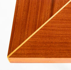 A Tommi Parzinger For Charak Modern Mahogany and Maple Dining Table With Leaves.