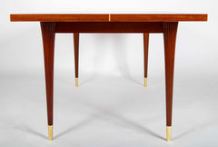 A Tommi Parzinger For Charak Modern Mahogany and Maple Dining Table With Leaves.