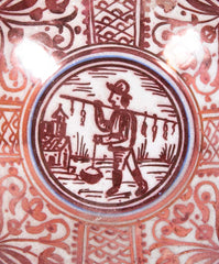 Ruby Lustre Ware Plate with Man Carrying Bird on a Stick