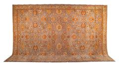 A Spanish Wool Carpet Having Floral Motifs