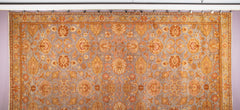A Spanish Wool Carpet Having Floral Motifs