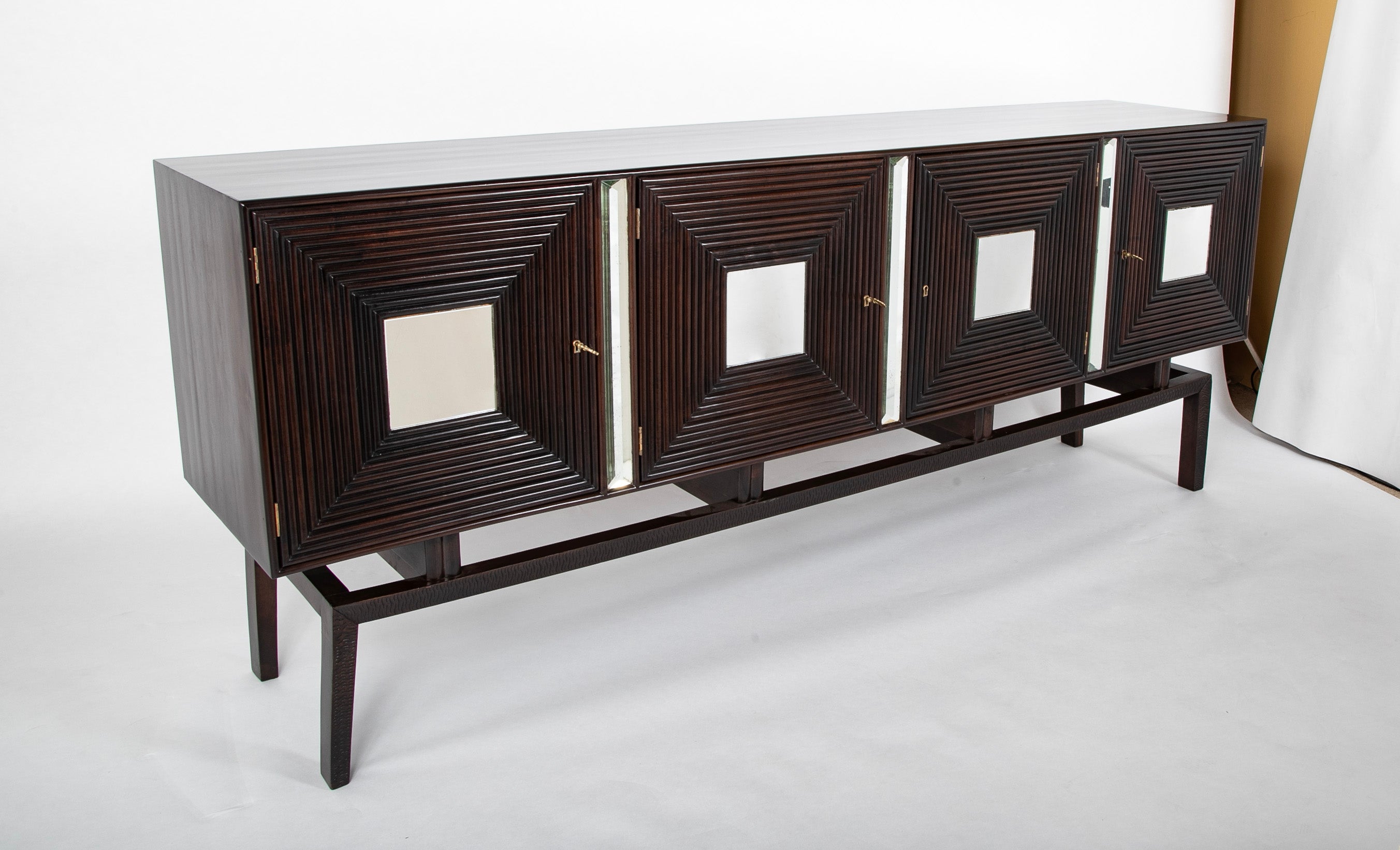 A Walnut Credenza by Giovanni Cavatorta A Walnut Credenza by Giovanni Cavatorta