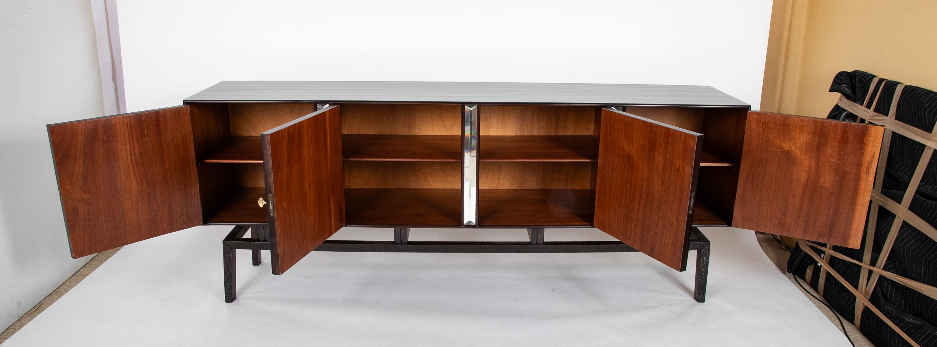 A Walnut Credenza by Giovanni Cavatorta A Walnut Credenza by Giovanni Cavatorta
