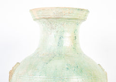 Han Dynasty Pottery Jar with Green Glaze and Molded Masks as Applied Handles
