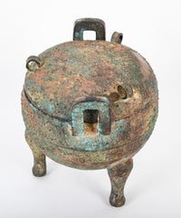 A Chinese Archaic Ding Style Bronze Covered Vessel