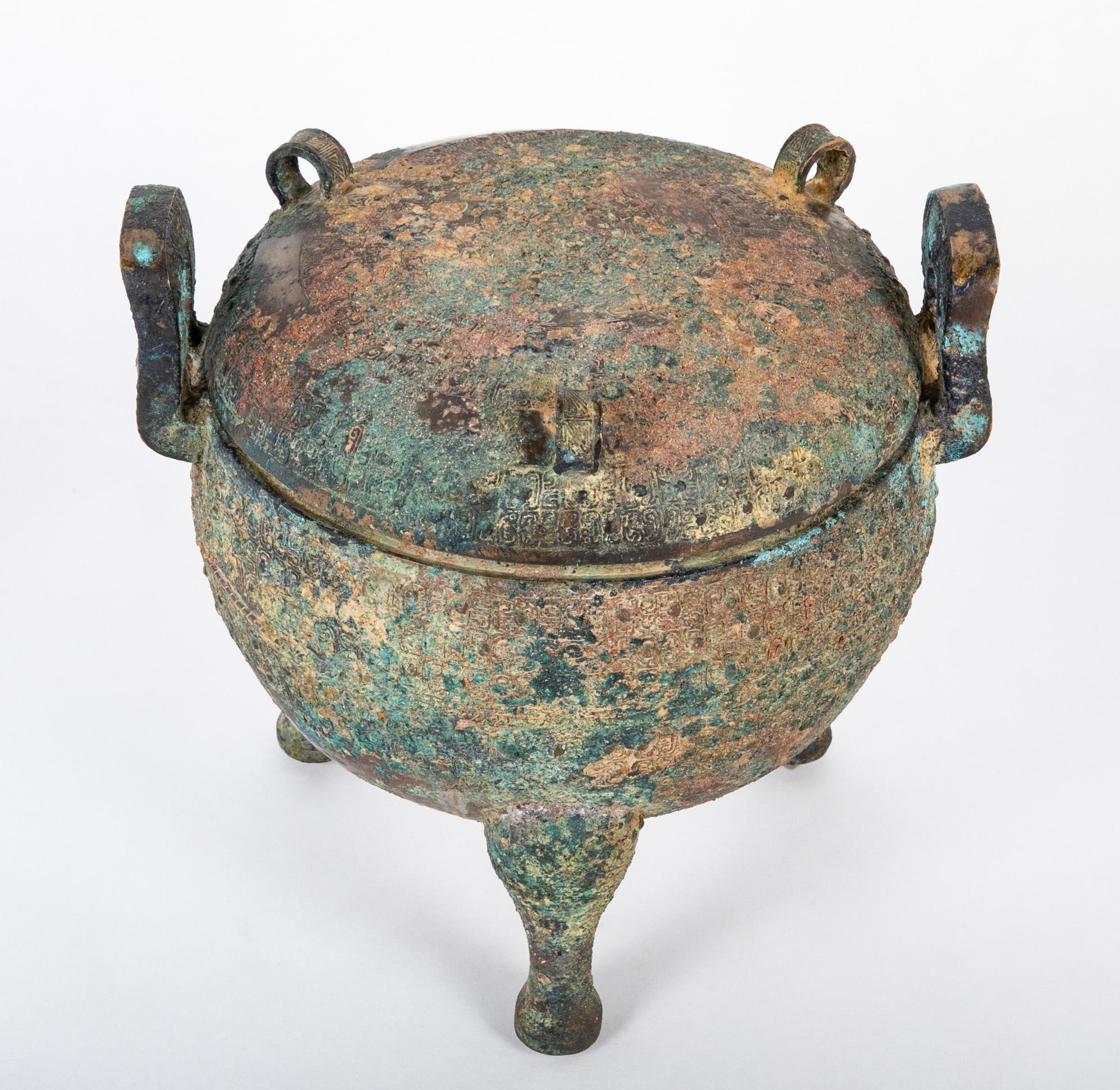 A Chinese Archaic Ding Style Bronze Covered Vessel