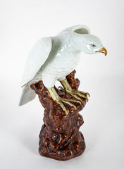 A Japanese White Glazed Porcelain Hawk Perched on a Tree Stump
