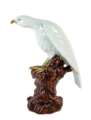 A Japanese White Glazed Porcelain Hawk Perched on a Tree Stump