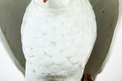 A Japanese White Glazed Porcelain Hawk Perched on a Tree Stump
