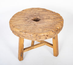 A 19th Century Wooden Mill Wheel as a Low Side Table