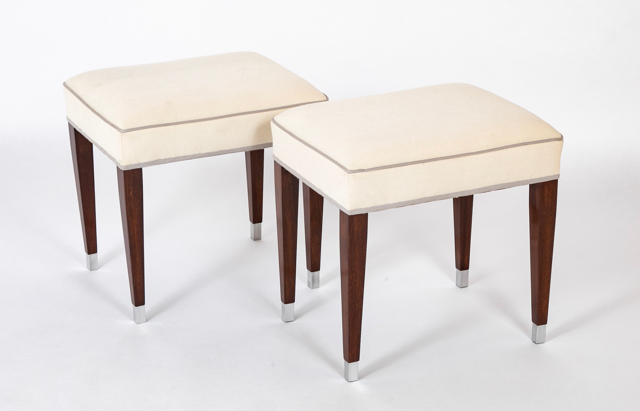 A Pair of Upholstered Stools by Jacques Adnet