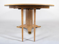 A Jules Leleu Bleached Oak Dining Table with Two Extension Leaves