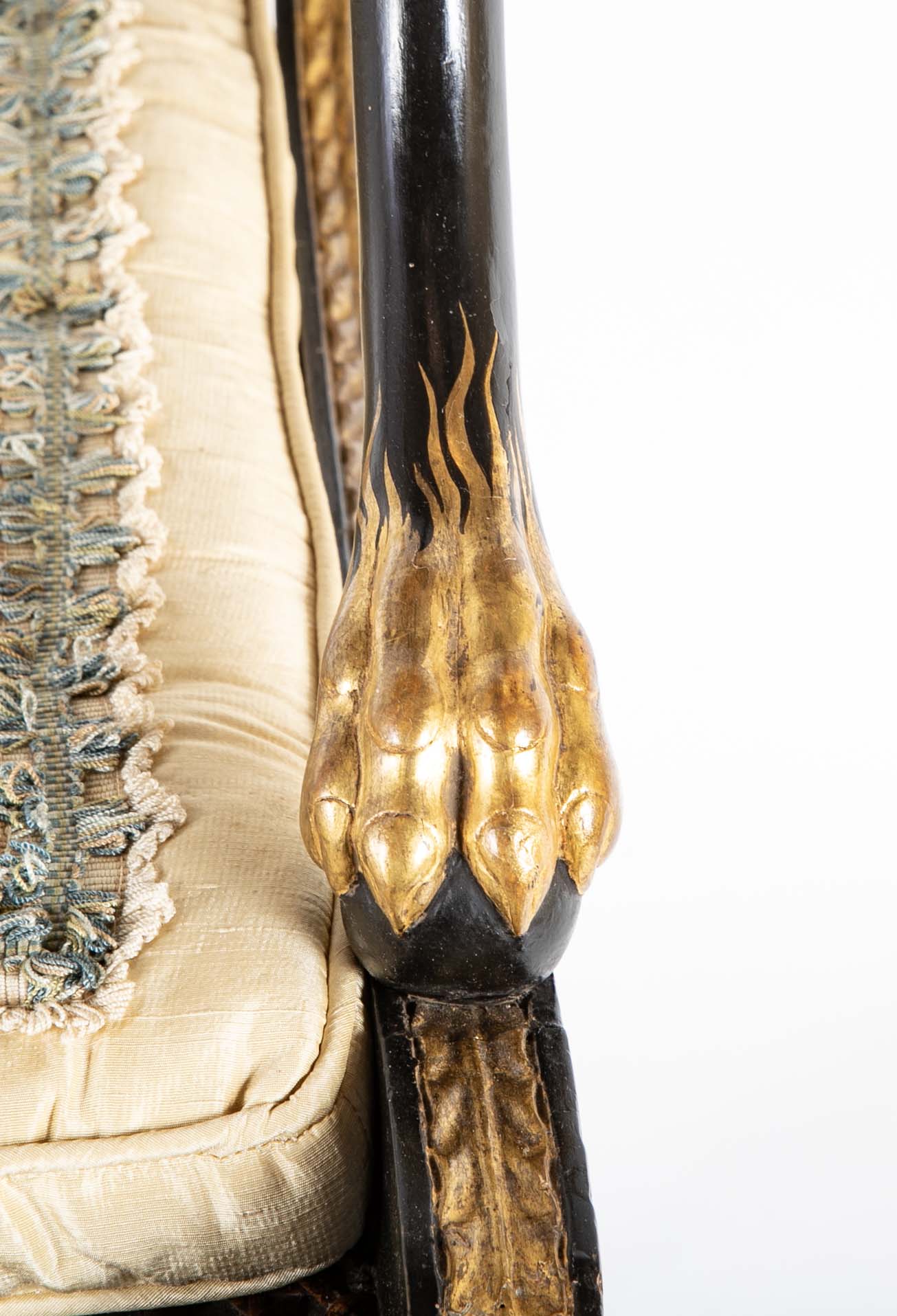 A Pair of Regency Style Ebonized and Parcel Gilt Armchairs