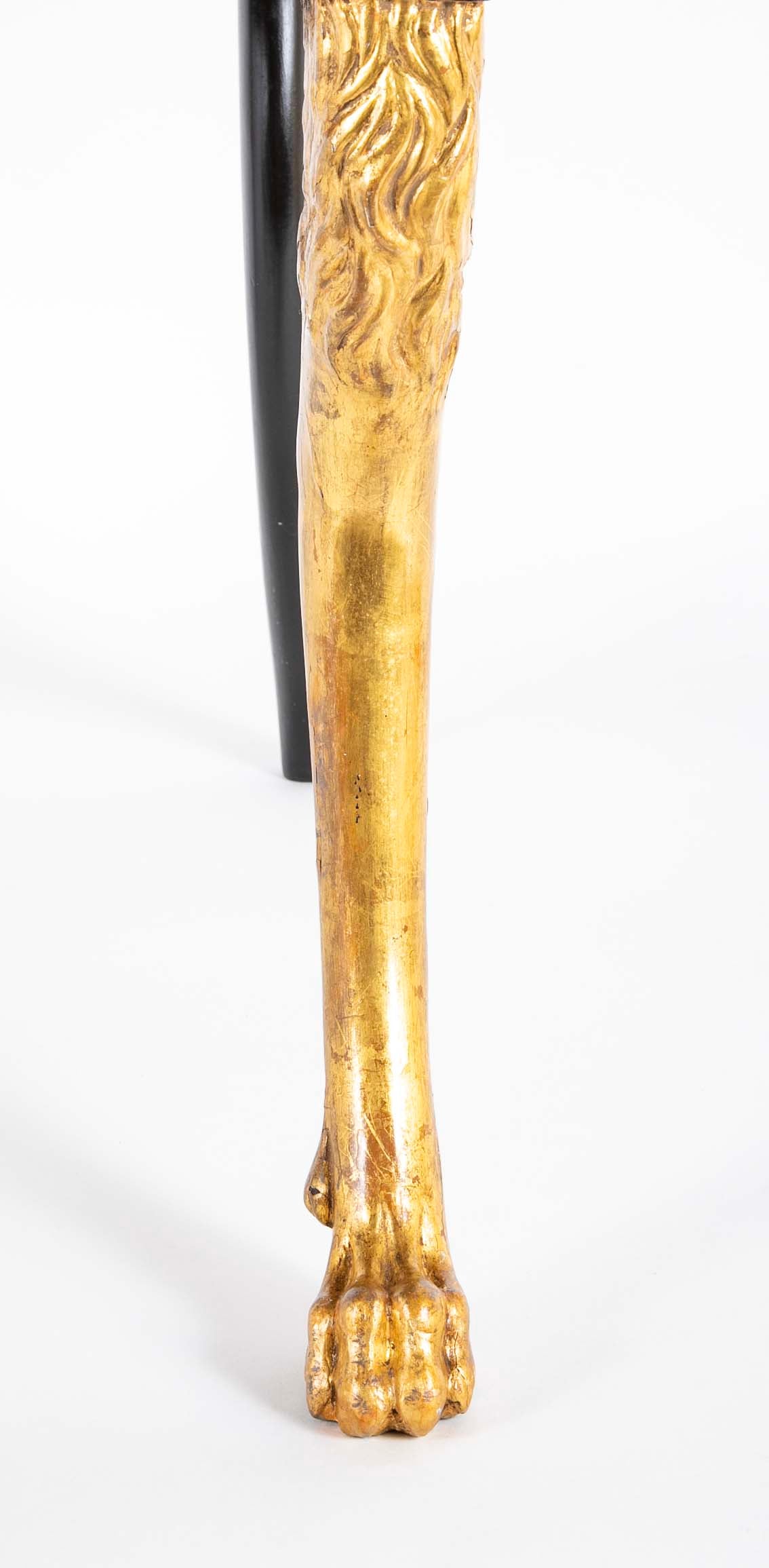 A Pair of Regency Style Ebonized and Parcel Gilt Armchairs