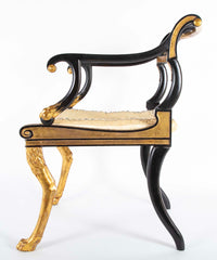 A Pair of Regency Style Ebonized and Parcel Gilt Armchairs