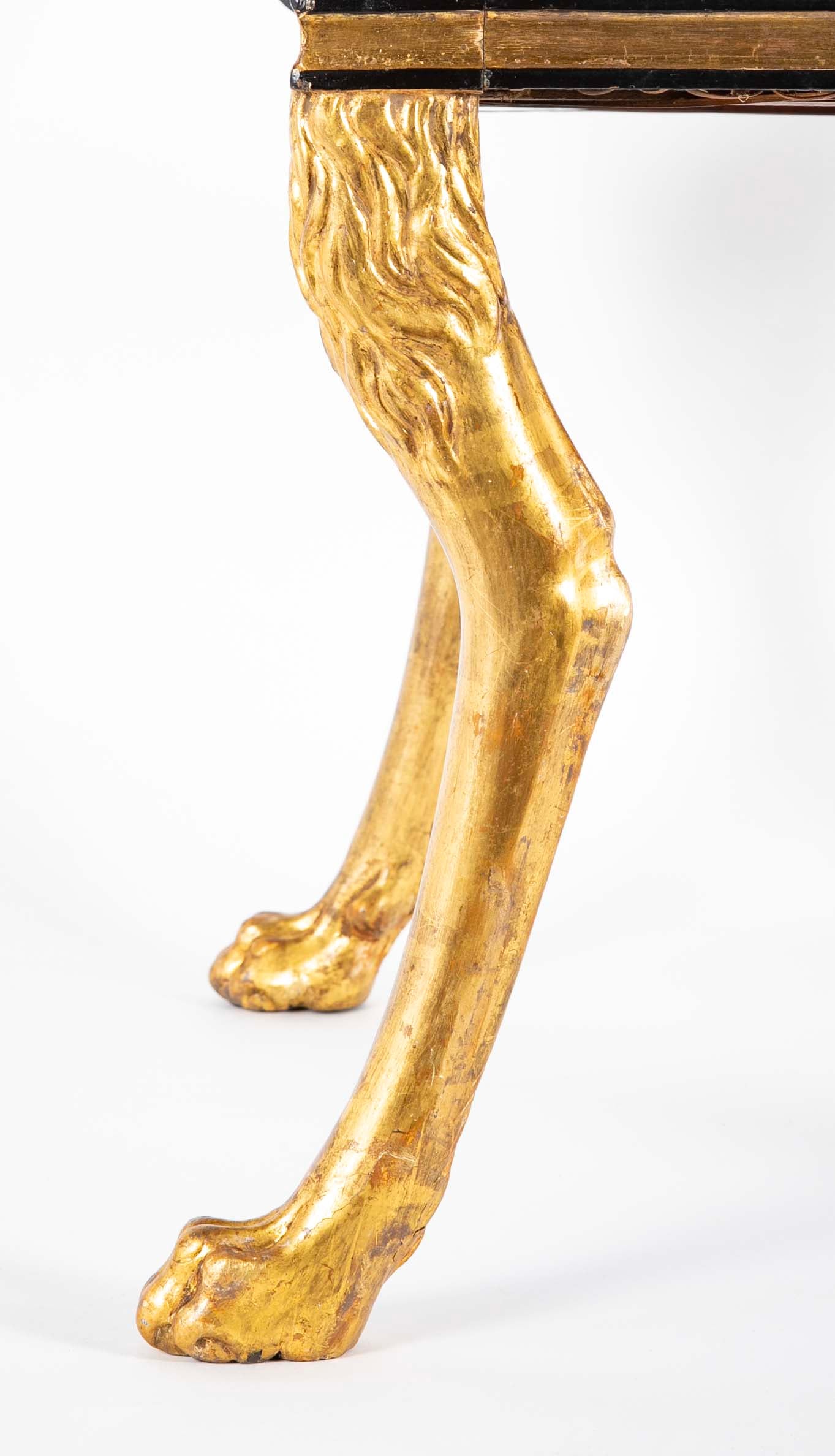 A Pair of Regency Style Ebonized and Parcel Gilt Armchairs