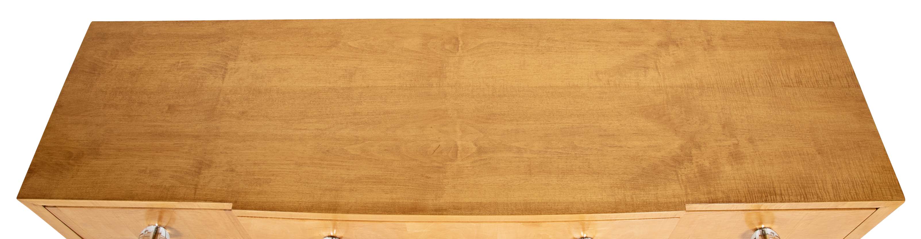 A French Sycamore Veneered Chest of Drawers Attributed to Andre Arbus