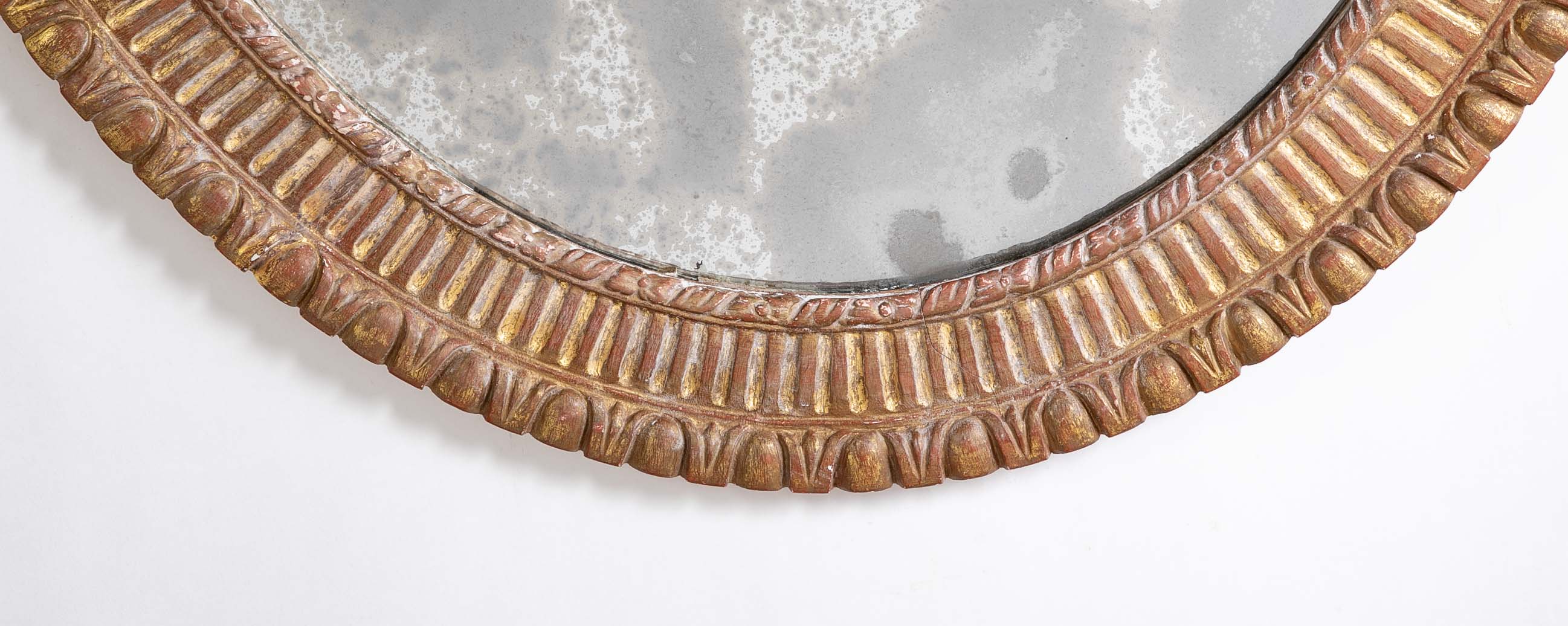 A George III Style Carved Giltwood Oval Mirror