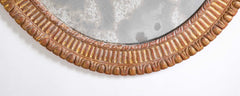 A George III Style Carved Giltwood Oval Mirror