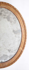 A George III Style Carved Giltwood Oval Mirror