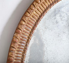 A George III Style Carved Giltwood Oval Mirror