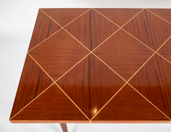A Tommi Parzinger for Charak Modern Mahogany and Maple Dining Table with Leaves.