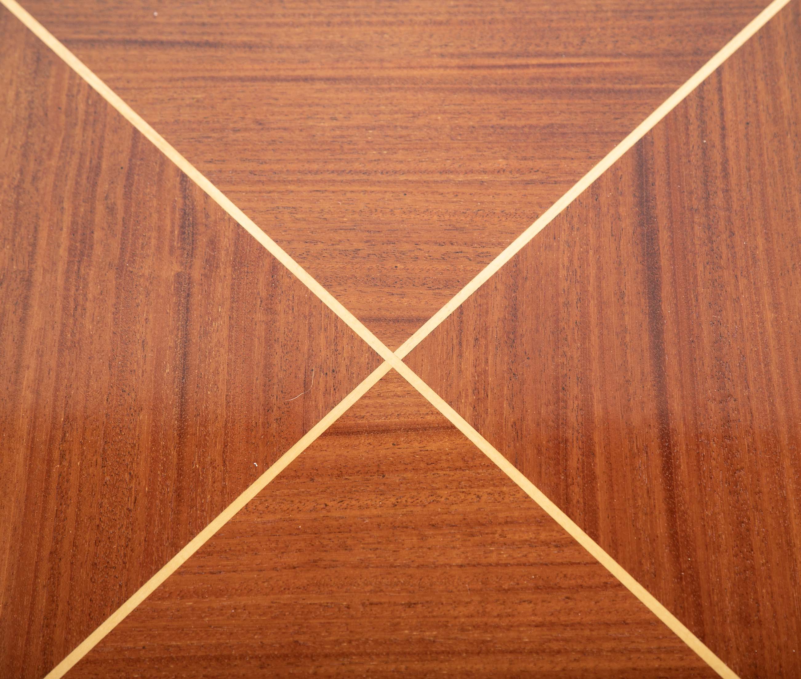 A Tommi Parzinger for Charak Modern Mahogany and Maple Dining Table with Leaves.