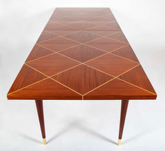 A Tommi Parzinger for Charak Modern Mahogany and Maple Dining Table with Leaves.