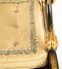 A Pair of Regency Style Ebonized and Parcel Gilt Armchairs