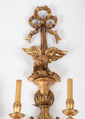 A Pair of Carved and Gilded Two Light Eagle Wall Sconces
