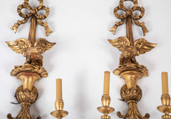 A Pair of Carved and Gilded Two Light Eagle Wall Sconces