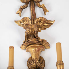 A Pair of Carved and Gilded Two Light Eagle Wall Sconces