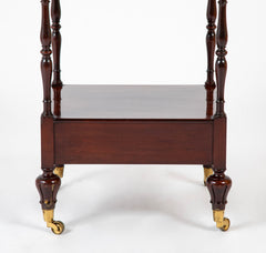 A Regency Four Tier Etagere with Rare Lotus Carved Legs