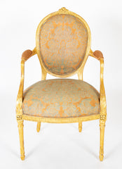 A Pair of George III Period Giltwood Oval Back "Elbow" Chairs