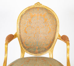 A Pair of George III Period Giltwood Oval Back "Elbow" Chairs