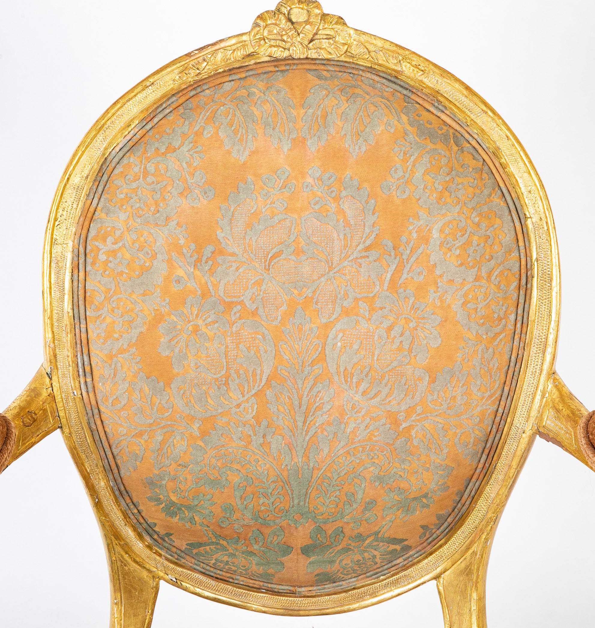 A Pair of George III Period Giltwood Oval Back "Elbow" Chairs
