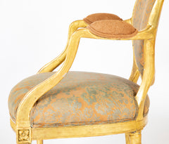 A Pair of George III Period Giltwood Oval Back "Elbow" Chairs