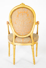 A Pair of George III Period Giltwood Oval Back "Elbow" Chairs