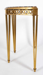 Striking Pair of Bronze Consoles with Fossilized Marble Tops